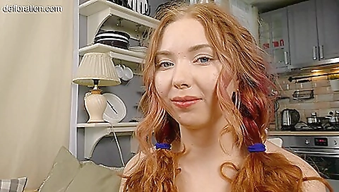 Redhead with a beautiful face and big boobs is masturbating