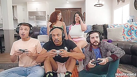 Redheaded woman getting fucked by a big black dick in a threesome